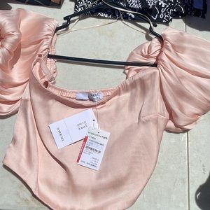The brand is Sophie Roo. It is a blush, pink, really soft and silky size Medium